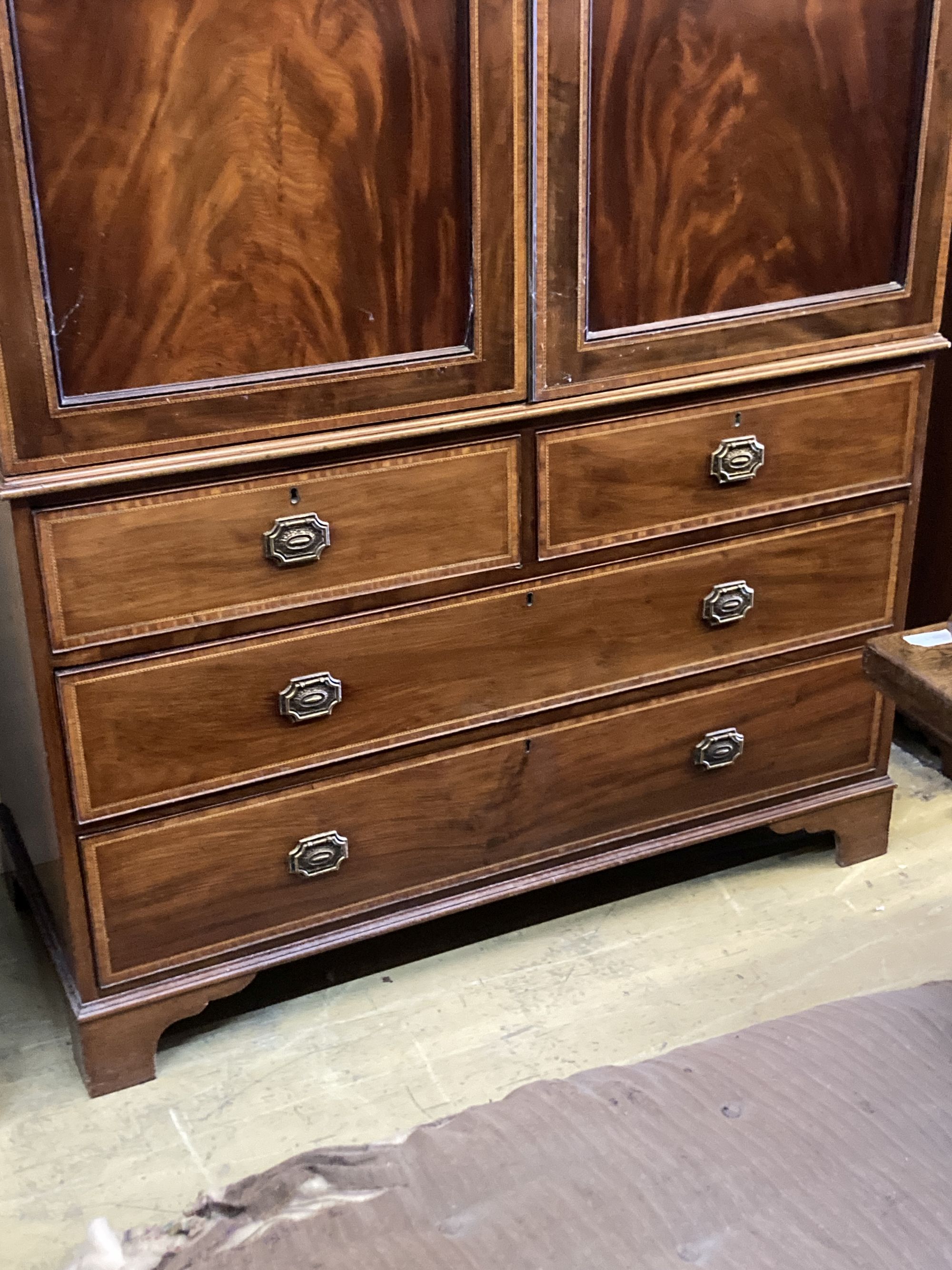 A George III style satinwood banded mahogany linen press, length 136cm, depth 59cm, height 200cm